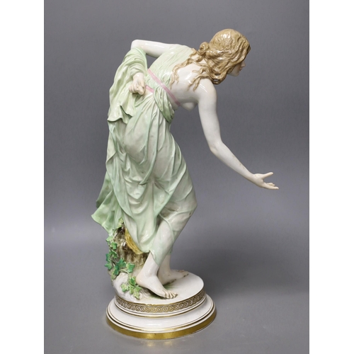 1408 - A Meissen Art Nouveau figurine of a young lady playing boules, early 20th century, modelled by Walte... 