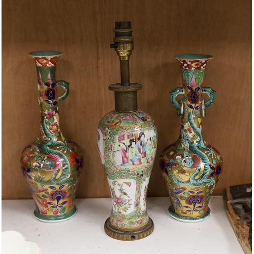 1417 - A Chinese overlaid glass snuff bottle, together with a Chinese famille rose vase converted into a la... 