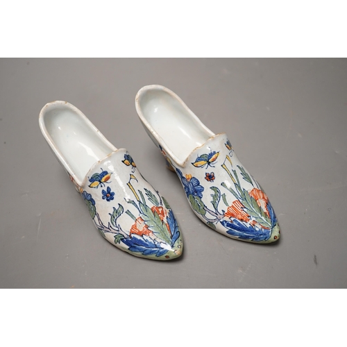 1433 - A pair of 19th century Delft polychrome models of shoes, 14cms wide