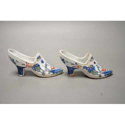 1433 - A pair of 19th century Delft polychrome models of shoes, 14cms wide