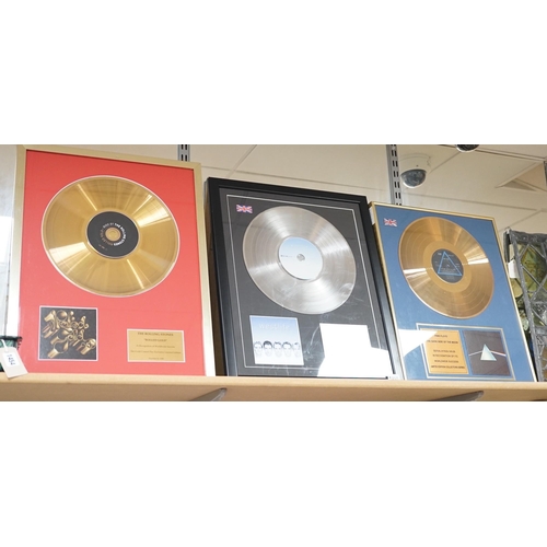 1455 - Three glazed framed award winning records:  Pink Floyd, The Rolling Stones and Westlife