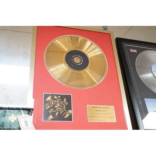 1455 - Three glazed framed award winning records:  Pink Floyd, The Rolling Stones and Westlife