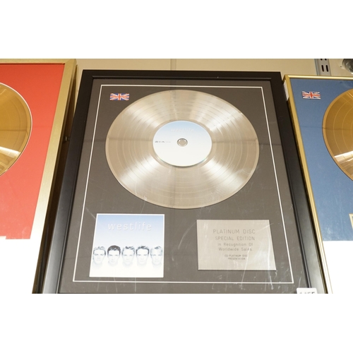 1455 - Three glazed framed award winning records:  Pink Floyd, The Rolling Stones and Westlife