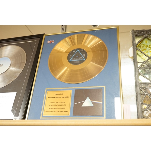 1455 - Three glazed framed award winning records:  Pink Floyd, The Rolling Stones and Westlife