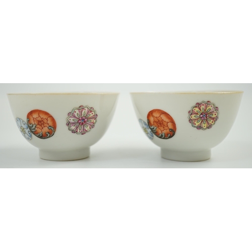 1466 - A pair of Chinese enamelled porcelain tea bowls, Qianlong seal marks,  7cms diameter