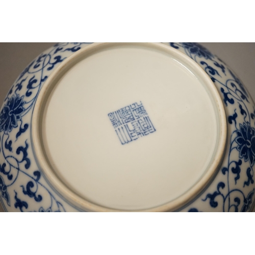 1475 - A pair of Chinese blue and 'white lotus' dishes, Qianlong marks, 16.5cms diameter