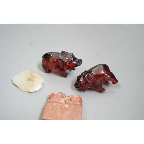 1483 - A Chinese Jade bi disc, two cherry amber ox and a soapstone seal