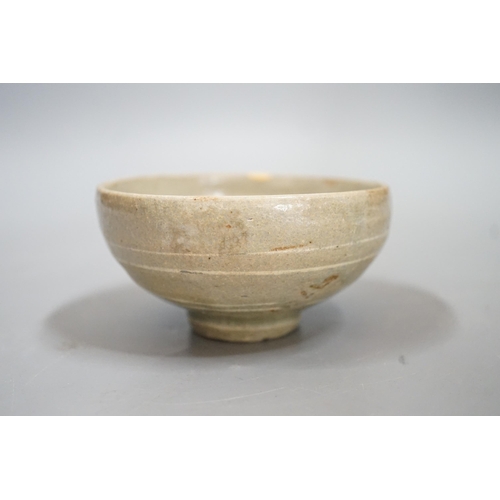 1511 - A Korean slip decorated celadon small bowl, Koryo dynasty. 10cm diameter Provenance- collected by th... 