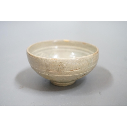 1511 - A Korean slip decorated celadon small bowl, Koryo dynasty. 10cm diameter Provenance- collected by th... 