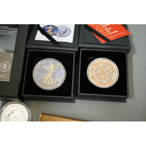 1522 - Ten bullion silver 1oz. commemorative coins, a bullion silver 2oz. coin and a Canada 2oz. silver ing... 