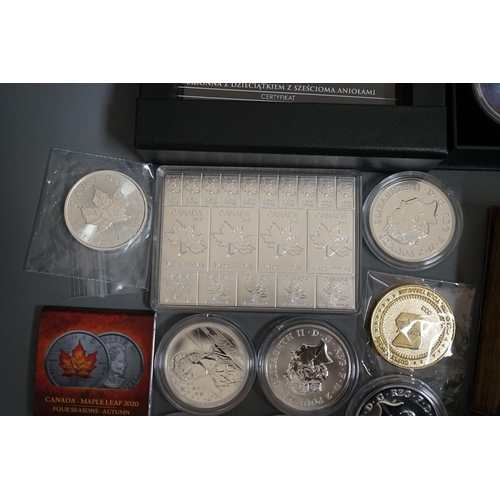 1522 - Ten bullion silver 1oz. commemorative coins, a bullion silver 2oz. coin and a Canada 2oz. silver ing... 