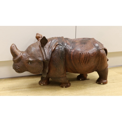 1528 - A carved wooden model of a rhinoceros, approximately 60cms long Ivory submission reference: 8MKPGY9L... 