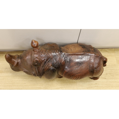 1528 - A carved wooden model of a rhinoceros, approximately 60cms long Ivory submission reference: 8MKPGY9L... 