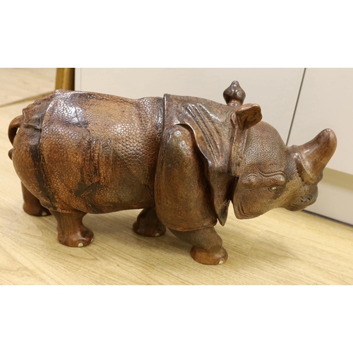 1528 - A carved wooden model of a rhinoceros, approximately 60cms long Ivory submission reference: 8MKPGY9L... 