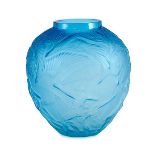 1529 - A Lalique style Archers pattern blue glass vase, 26cms high