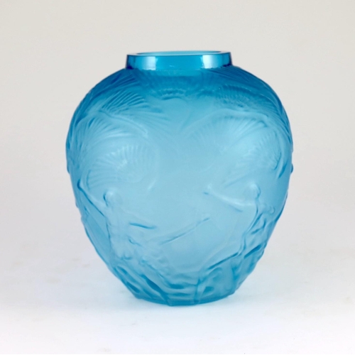 1529 - A Lalique style Archers pattern blue glass vase, 26cms high