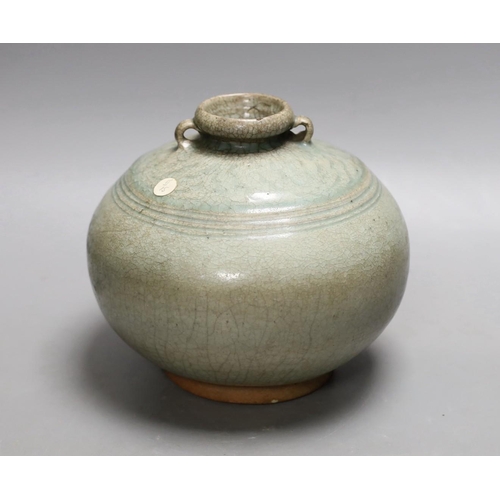 1553 - A Thai Sawankhalok green glazed ring handled jar, 15th century Provenance- collected by the vendors... 