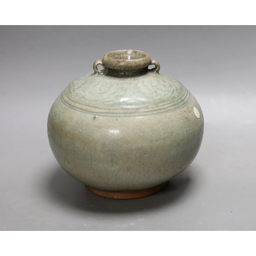 1553 - A Thai Sawankhalok green glazed ring handled jar, 15th century Provenance- collected by the vendors... 