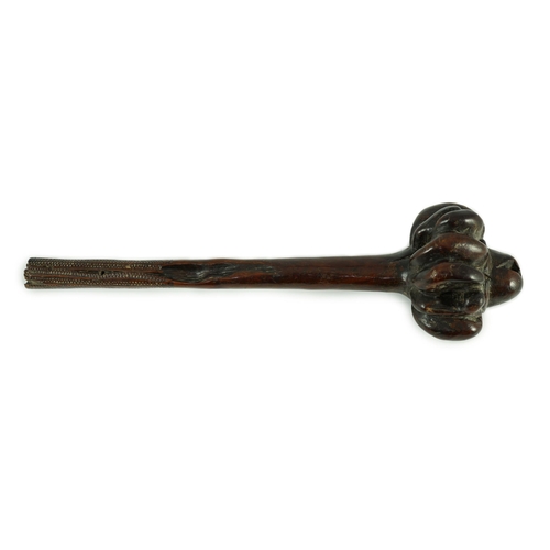 1571 - A Fijian hardwood throwing club, with zig-zag relief carved handle and further irregular spotted dec... 