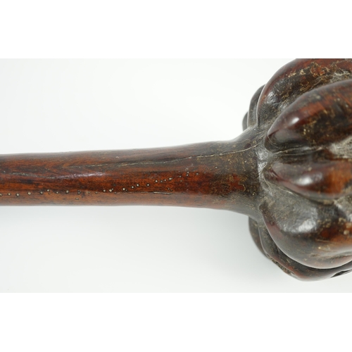 1571 - A Fijian hardwood throwing club, with zig-zag relief carved handle and further irregular spotted dec... 