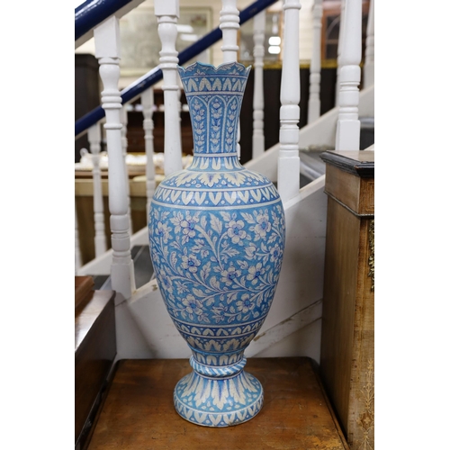 1583 - A large Persian fritware floral decorated vase, 67cm tall