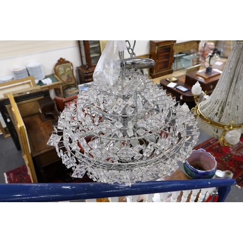 1586 - A ten tier, eighteen light, graduated chrome chandelier, with diamond shaped clear perspex drops... 