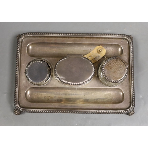 1820 - A late Victorian silver rectangular inkstand, with two wells and central lidded compartment, (glass ... 