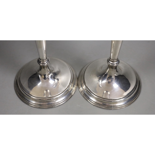 1833 - A pair of North American sterling candlesticks, with tapering stems, on circular bases, height 35.7c... 