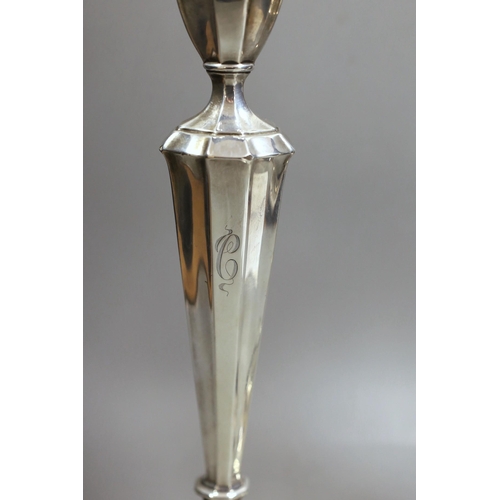 1834 - A pair of North American sterling candlesticks, with panelled stems and shaped oval bases, 34.1cm, w... 