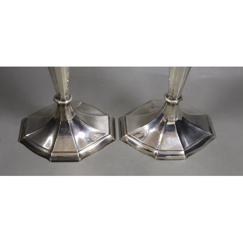 1834 - A pair of North American sterling candlesticks, with panelled stems and shaped oval bases, 34.1cm, w... 