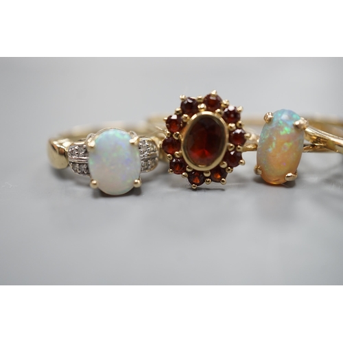 1875 - Five assorted modern 9ct gold and gem set dress rings, including white opal and diamond chip cluster... 