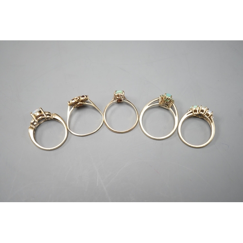 1875 - Five assorted modern 9ct gold and gem set dress rings, including white opal and diamond chip cluster... 