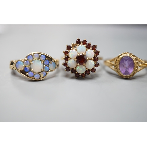 1876 - Five assorted modern 9ct gold and gem set dress rings, including, white opal cluster, garnet and whi... 