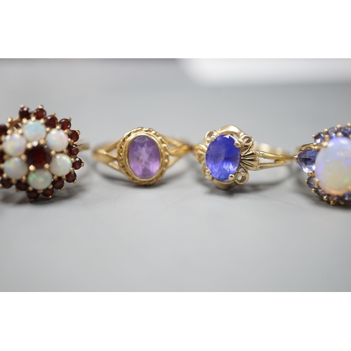 1876 - Five assorted modern 9ct gold and gem set dress rings, including, white opal cluster, garnet and whi... 