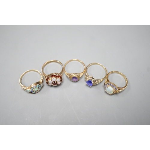 1876 - Five assorted modern 9ct gold and gem set dress rings, including, white opal cluster, garnet and whi... 