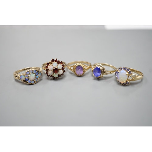 1876 - Five assorted modern 9ct gold and gem set dress rings, including, white opal cluster, garnet and whi... 