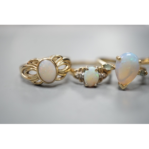 1877 - Five assorted modern 9ct gold and gem set dress rings, including white opal and garnet oval cluster,... 