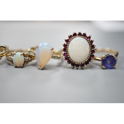 1877 - Five assorted modern 9ct gold and gem set dress rings, including white opal and garnet oval cluster,... 