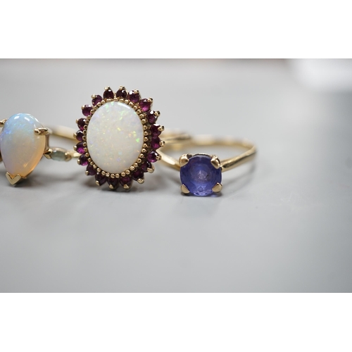 1877 - Five assorted modern 9ct gold and gem set dress rings, including white opal and garnet oval cluster,... 