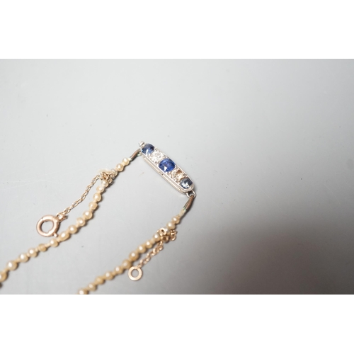 1878 - A single strand graduated natural saltwater pearl necklace, with sapphire and diamond set clasp, 44c... 