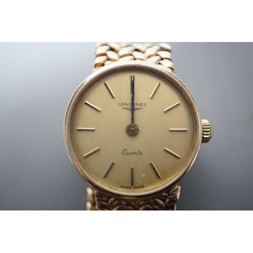 1883 - A lady's 9ct gold  Longines quartz wrist watch on an inegral 9ct gold bracelet, with Longines box, g... 