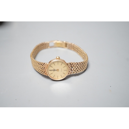 1883 - A lady's 9ct gold  Longines quartz wrist watch on an inegral 9ct gold bracelet, with Longines box, g... 