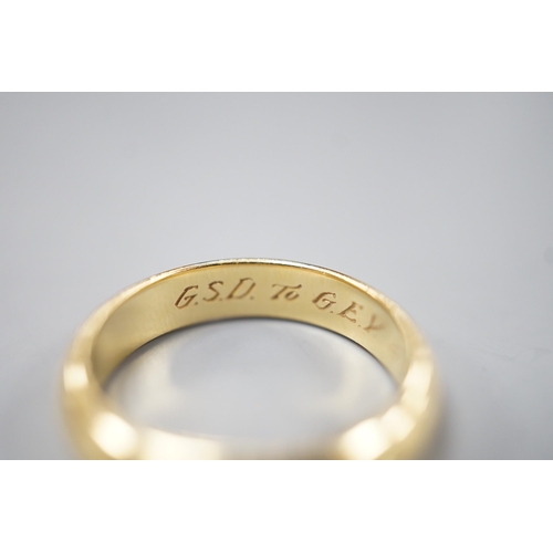 1912 - A 1970's 18ct gold wedding band, with engraved inscription, size O/P, 6.7 grams.