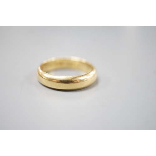 1912 - A 1970's 18ct gold wedding band, with engraved inscription, size O/P, 6.7 grams.