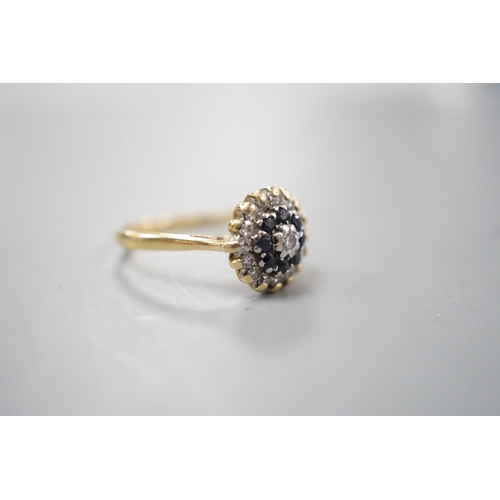 1913 - A 1960's 18ct gold, 18ct gold, sapphire and diamond set circular cluster ring, size O, gross weight ... 