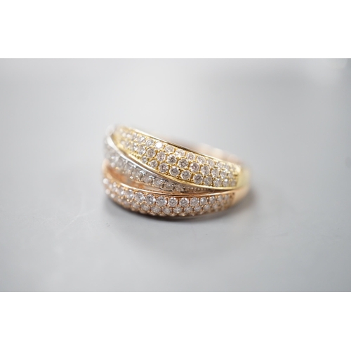 1915 - A modern three colour 18ct gold and diamond chip set triple band crossover ring, size O, gross weigh... 