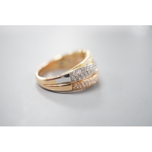 1915 - A modern three colour 18ct gold and diamond chip set triple band crossover ring, size O, gross weigh... 