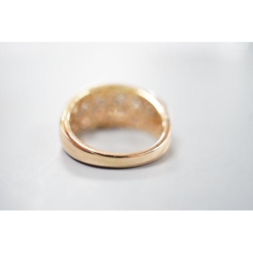 1915 - A modern three colour 18ct gold and diamond chip set triple band crossover ring, size O, gross weigh... 