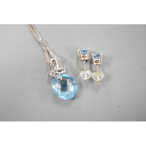 1924 - A modern 14k white metal, facetted pear cut blue topaz and diamond chip set pendant, 19mm, on a 750 ... 