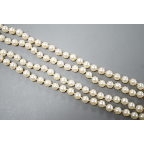 1928 - A long single strand cultured pearl necklace with cultured pearl set 9ct white gold clasp, 75cm.... 